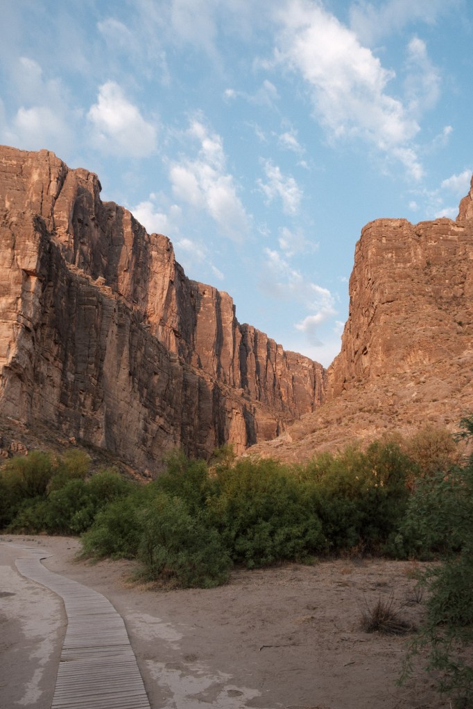 Start of the Santa Elena Canyon trail with the towering canyon walls in the background as the main focal point.