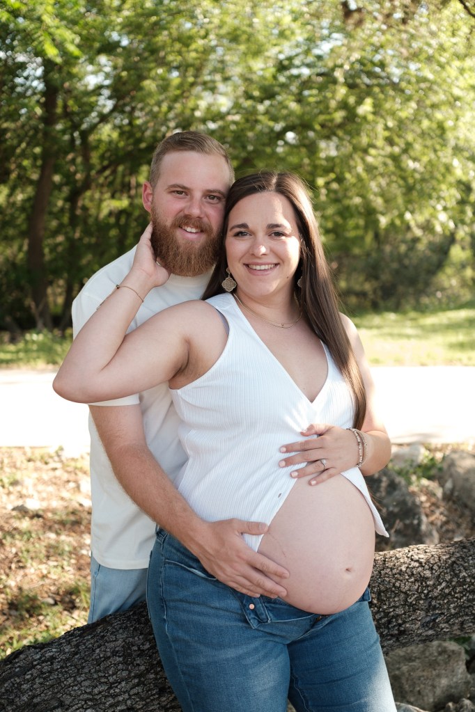 smiling pregnant woman with husband