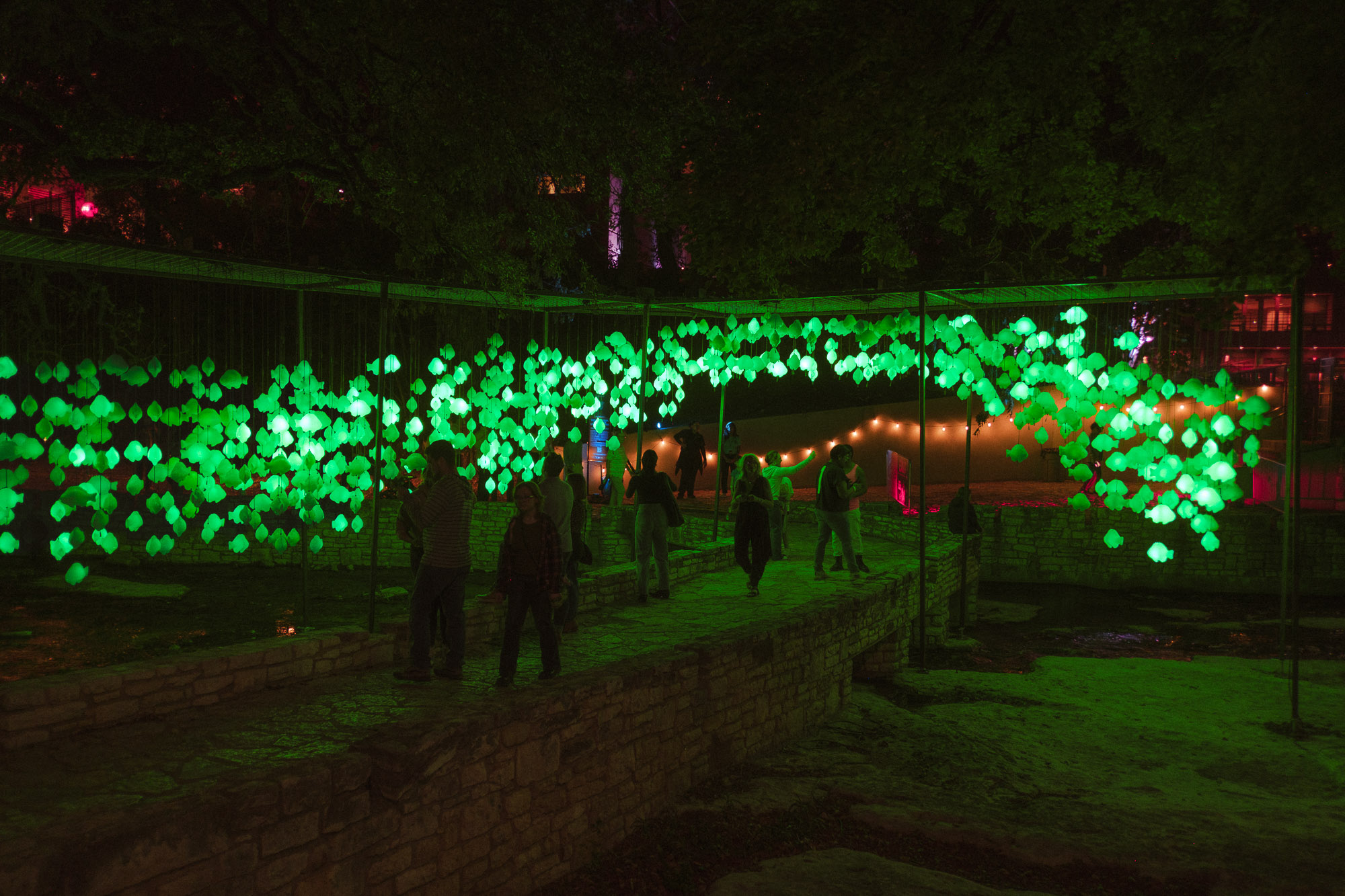 Waller Creek High School of Extraordinary Fish installation suspended above walkway photographed handheld using Fuji X-T30 and XF 18mm f2.