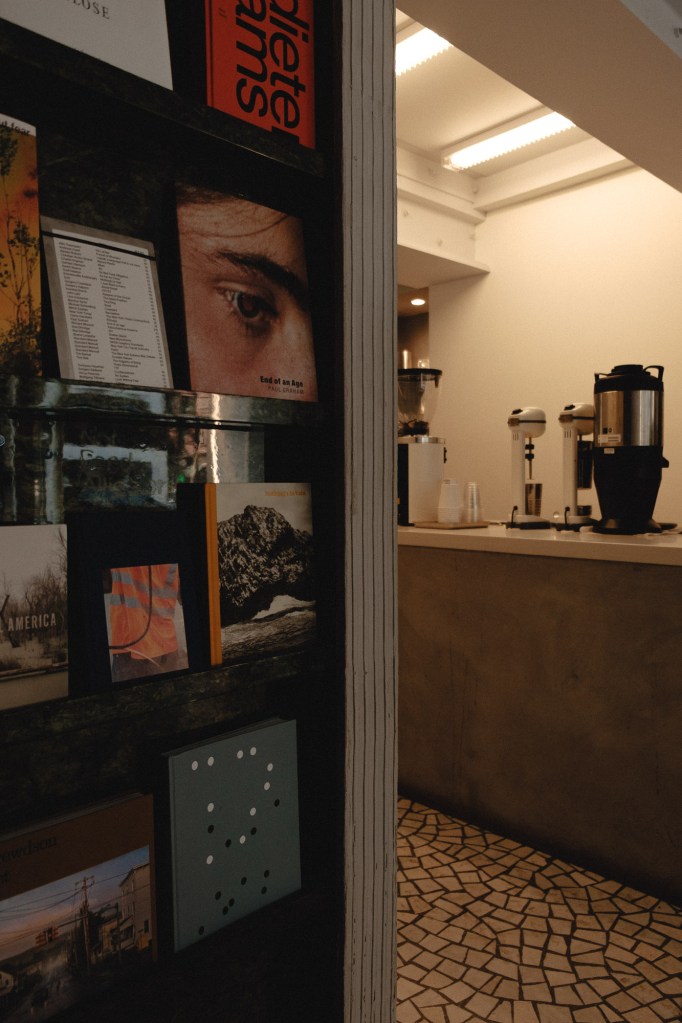 Coffee shop display and warm tones captured handheld in New York City using Fuji X-E2 travel photography setup.