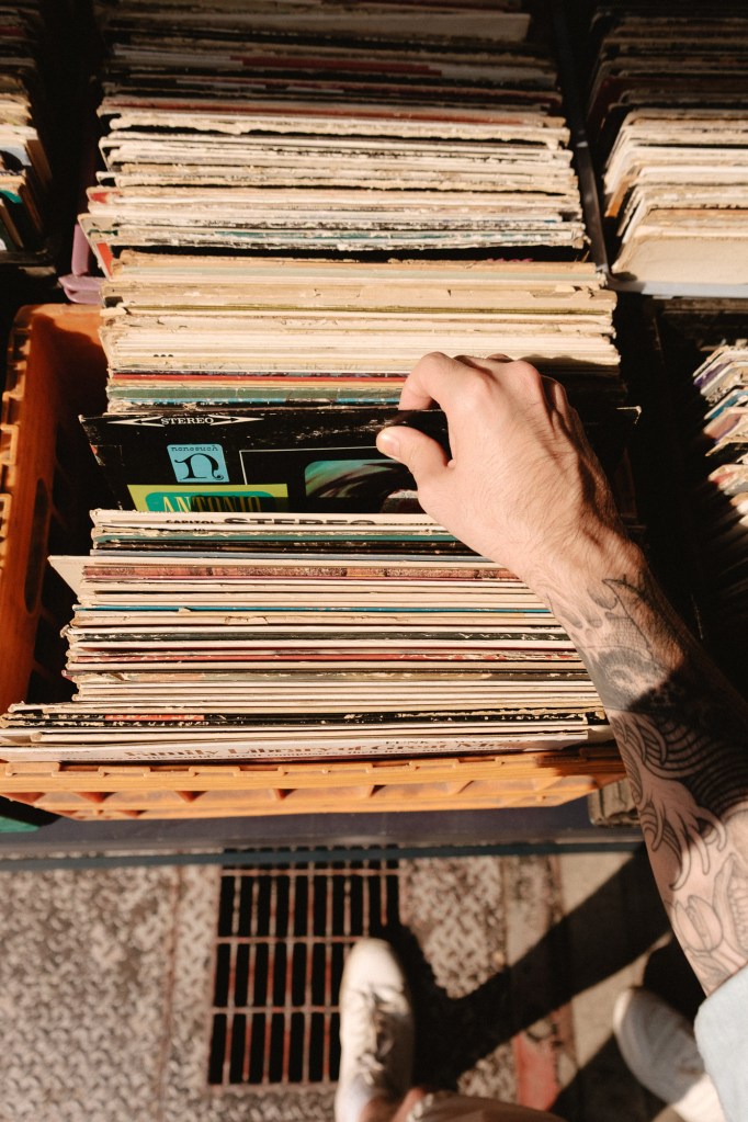 Browsing through record store bins and browsing in NYC using Fuji XF 18-55mm lens.