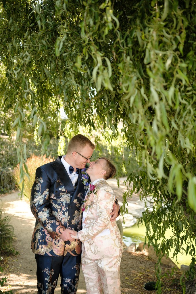 Bride and groom candid moment inside Madonna Inn garden space captured using Fuji X-T5 for wedding photography.