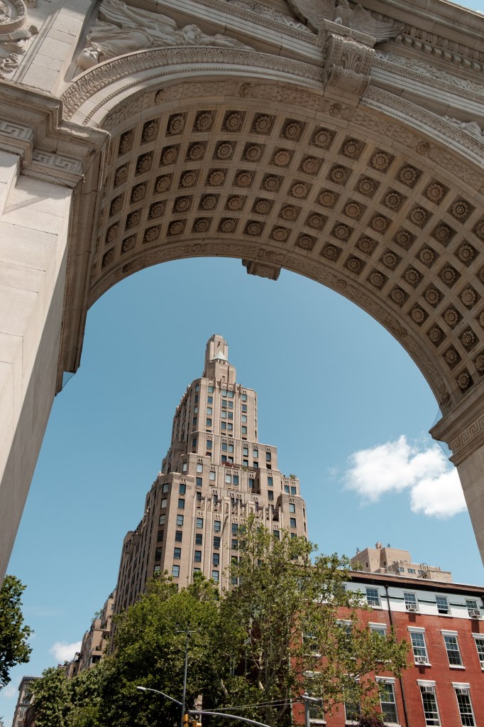 Framed view of New York City architecture through surrounding buildings photographed with Fuji X-E2.