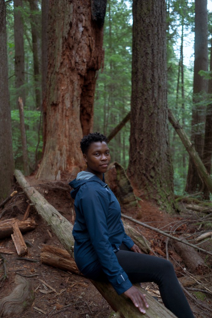 Woman framed against nature background in Vancouver photographed with Sony A7.