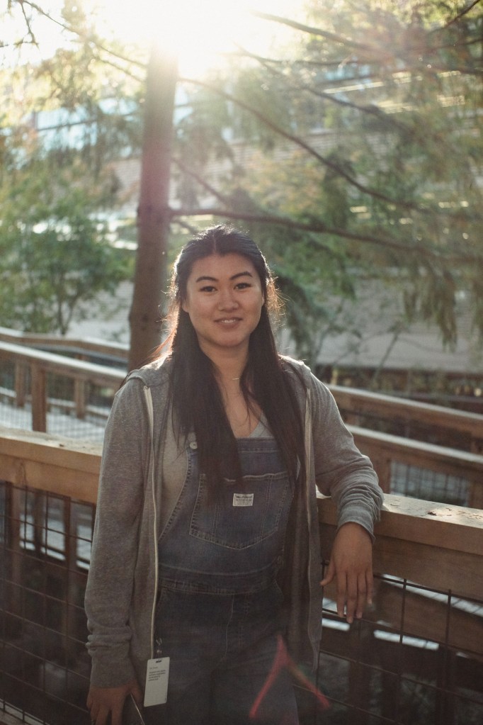 Portrait with sunlight hitting lens creating flare using Fuji X-E2 sample setup.