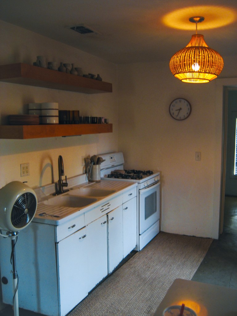 Canon SD600 photo of Airbnb kitchen interior in Marfa, Texas showing warm natural light and vintage digital camera colors.