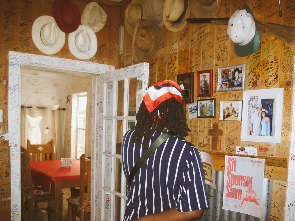 Portrait of woman inside Marfa Tacos captured with Canon SD600 point-and-shoot camera.