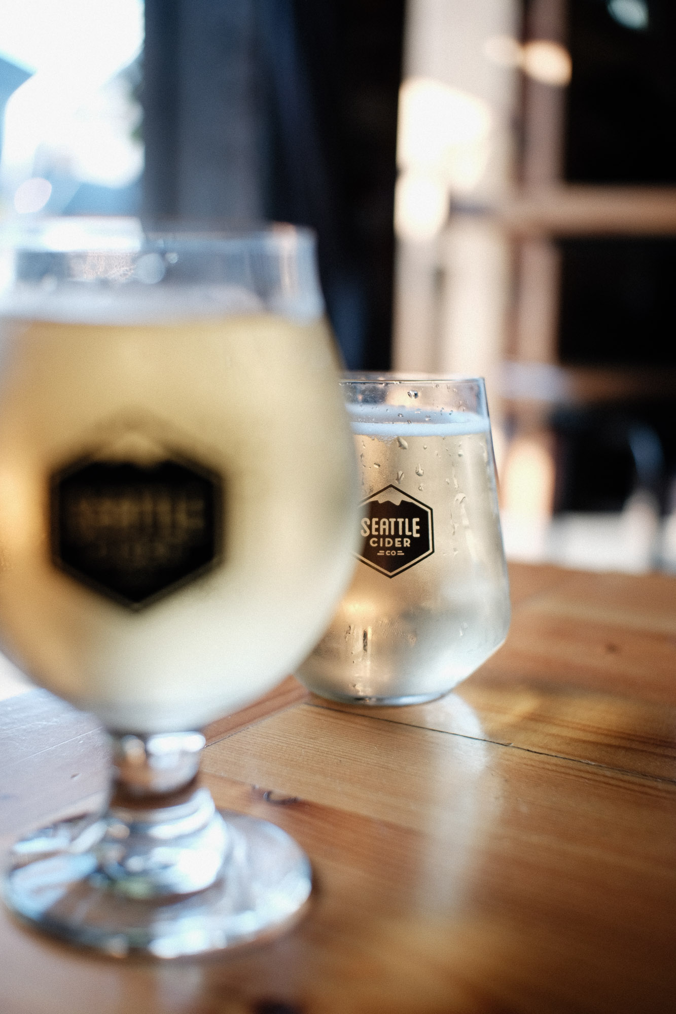 Close-up of cider drink at Seattle Cider Company showing color and texture in natural light.
